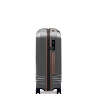 ROAM Matte Edit hardside expandable check-in suitcase in matte steel with saddle trim, side view