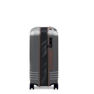 ROAM Matte Edit hardside expandable check-in suitcase in matte steel with saddle trim, side view, expanded
