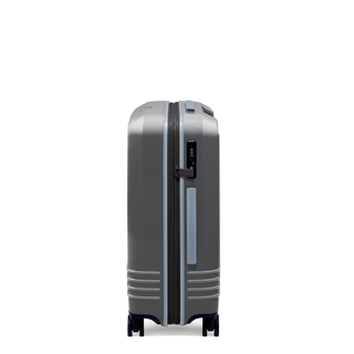 ROAM Matte Edit hardside expandable check-in suitcase in matte steel with slate trim, side view
