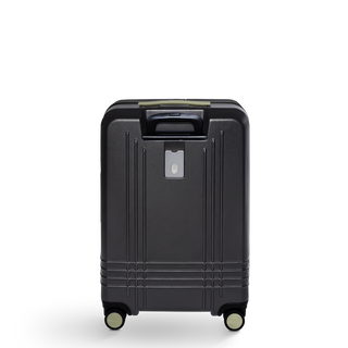 ROAM Matte Edit hardside check-in suitcase in matte black with green trim, back view