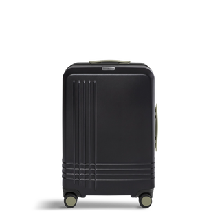 ROAM Matte Edit hardside check-in suitcase in matte black with green trim, front view