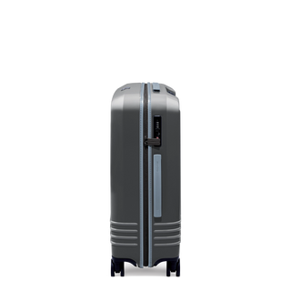 ROAM Matte Edit hardside check-in suitcase in matte steel with slate trim, side view