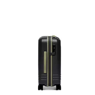 ROAM Matte Edit hardside expandable carry-on suitcase in matte black with green trim, side view