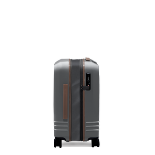 ROAM Matte Edit hardside expandable carry-on suitcase in matte steel with saddle trim, side view, expanded