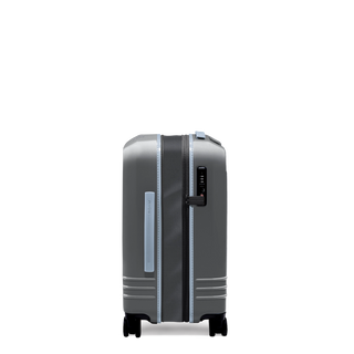 ROAM Matte Edit hardside expandable carry-on suitcase in matte steel with slate trim, side view, expanded