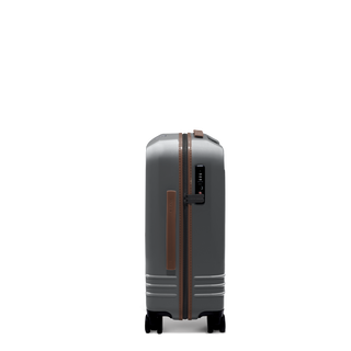 ROAM Matte Edit hardside carry-on suitcase in matte steel with saddle trim, side view