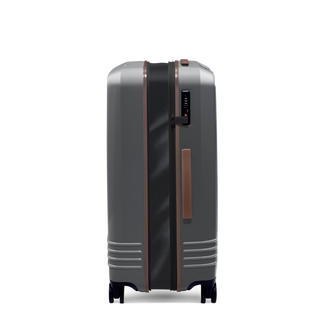 ROAM Matte Edit hardside expandable large check-in suitcase in matte steel with saddle trim, side view, expanded