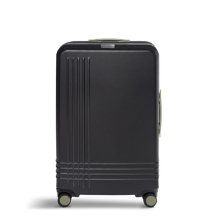 ROAM Matte Edit hardside large check-in suitcase in matte black with green trim, front view