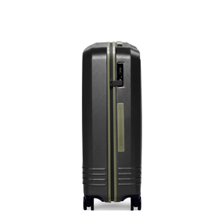 ROAM Matte Edit hardside large check-in suitcase in matte black with green trim, side view