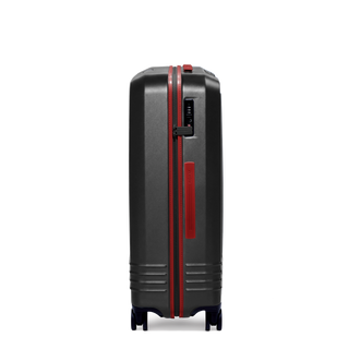 ROAM Matte Edit hardside large check-in suitcase in matte black with red trim, side view