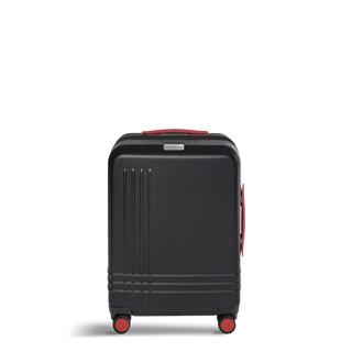 ROAM Matte Edit hardside large carry-on suitcase in matte black with red trim, front view